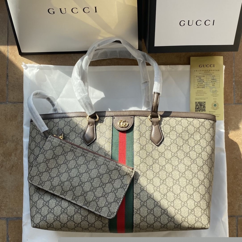 G*u*i shopping bags